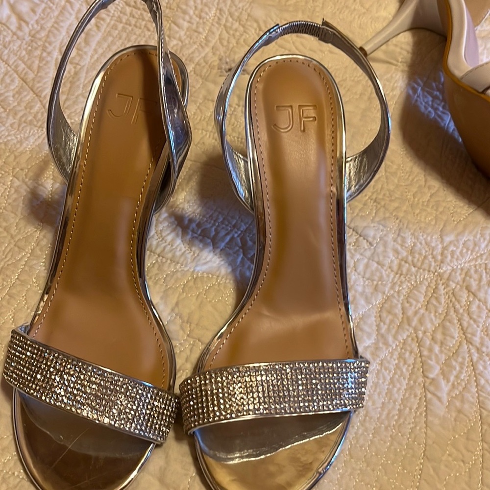 Beautiful silver and diamond heels Never worn. NWT. Love them!